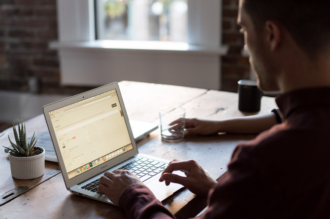 Man teaching business owner how to update their own website